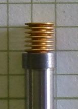 memory metal shrink ring clamps servometer electroformed bellows to steel cylinder